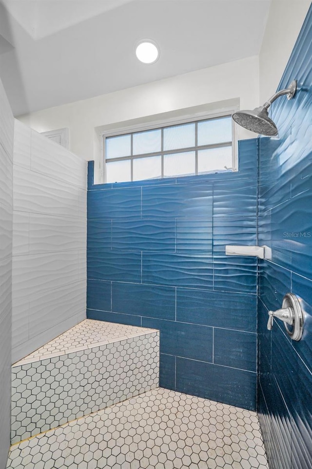 bathroom with a tile shower