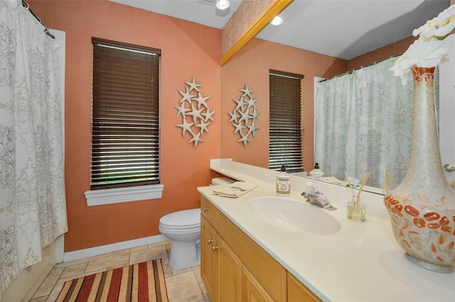 full bathroom featuring tile patterned floors, curtained shower, toilet, and vanity