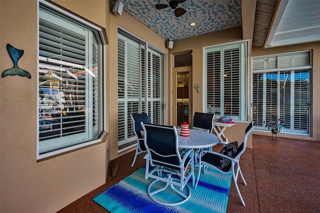 view of patio / terrace featuring outdoor dining space and a ceiling fan