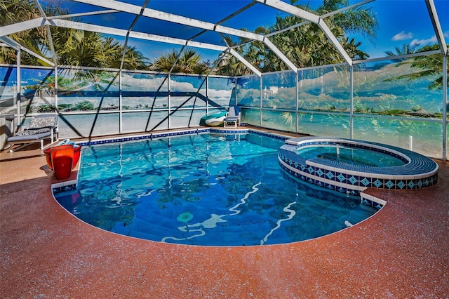 view of pool featuring a lanai and a pool with connected hot tub