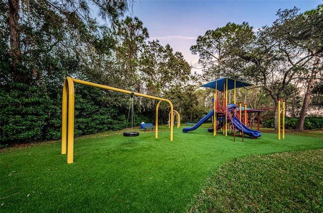 community jungle gym with a yard