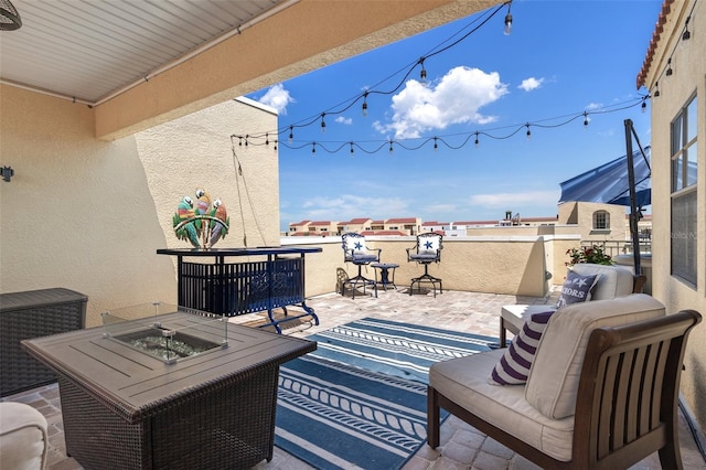 view of patio / terrace featuring a fire pit