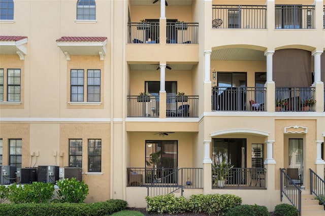 view of building exterior with central AC unit