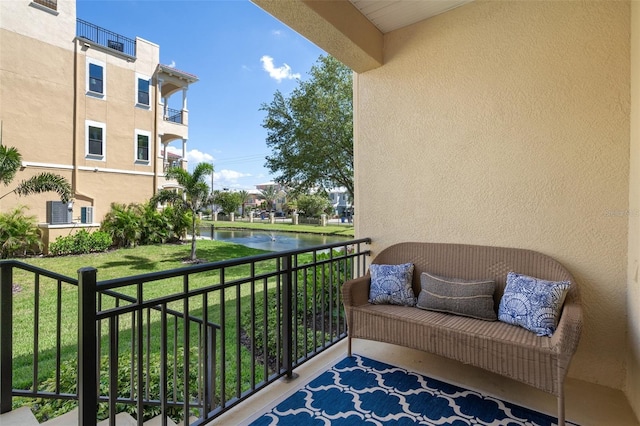 balcony featuring a water view