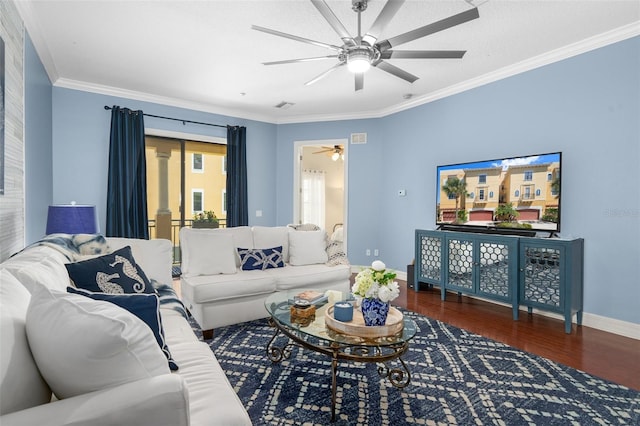 living room featuring baseboards, ceiling fan, dark wood finished floors, and crown molding