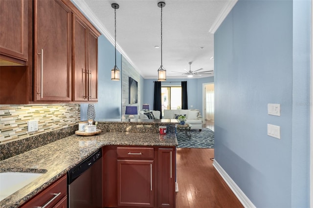 kitchen with open floor plan, hanging light fixtures, dishwasher, dark stone counters, and crown molding