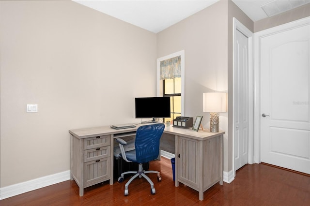 office with baseboards and dark wood-style flooring