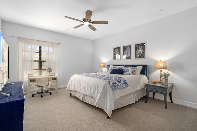 bedroom featuring ceiling fan, carpet floors, and baseboards