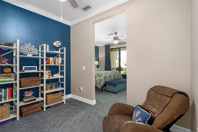 living area with ceiling fan, crown molding, visible vents, and carpet flooring