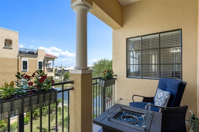 balcony featuring a water view