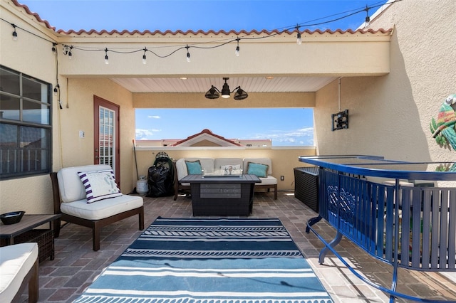 view of patio / terrace featuring an outdoor living space with a fire pit