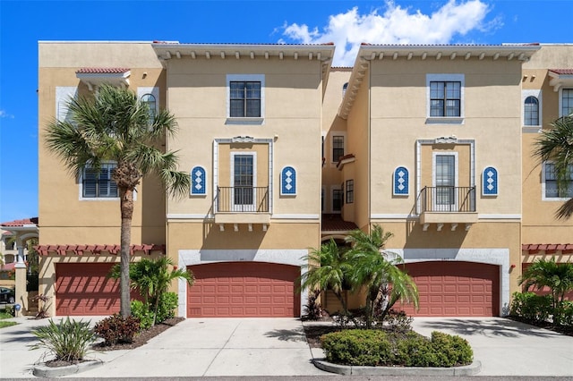 6411 Mayra Shores Ln, Apollo Beach, FL 33572 - view of front of home featuring stucco siding, an attached garage, and driveway