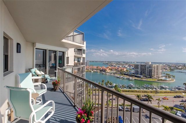 balcony featuring a water view