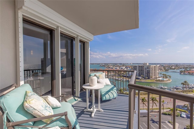 balcony featuring a water view and a view of city