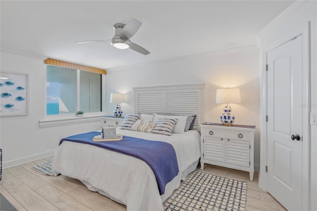 bedroom featuring baseboards, wood tiled floor, a ceiling fan, and crown molding