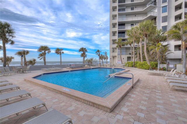 community pool with a patio area