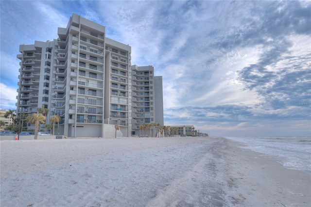 view of property with a view of the beach