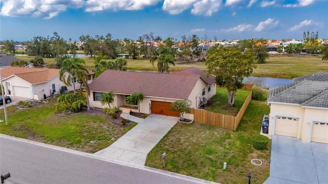 drone / aerial view featuring a water view and a residential view