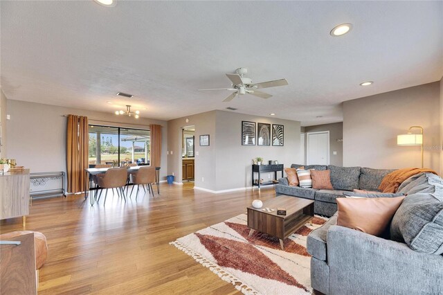 811 Eagle Ln, Apollo Beach, FL 33572 - living room with light wood-style floors, a ceiling fan, and recessed lighting