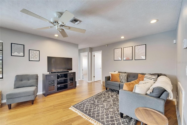 811 Eagle Ln, Apollo Beach, FL 33572 - living area featuring ceiling fan, a textured ceiling, light wood-type flooring, and recessed lighting