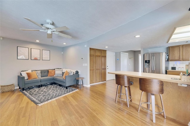 811 Eagle Ln, Apollo Beach, FL 33572 - living room with light wood-style flooring, ceiling fan, and recessed lighting