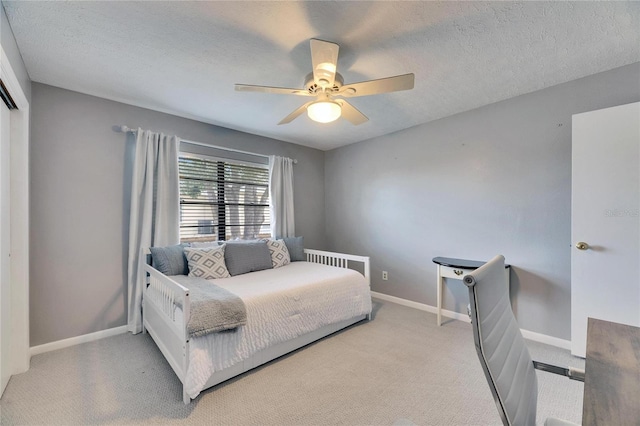 811 Eagle Ln, Apollo Beach, FL 33572 - carpeted bedroom with a textured ceiling and a ceiling fan