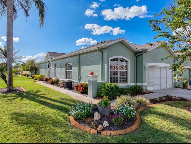 view of property exterior with central AC, stucco siding, a lawn, a garage, and driveway