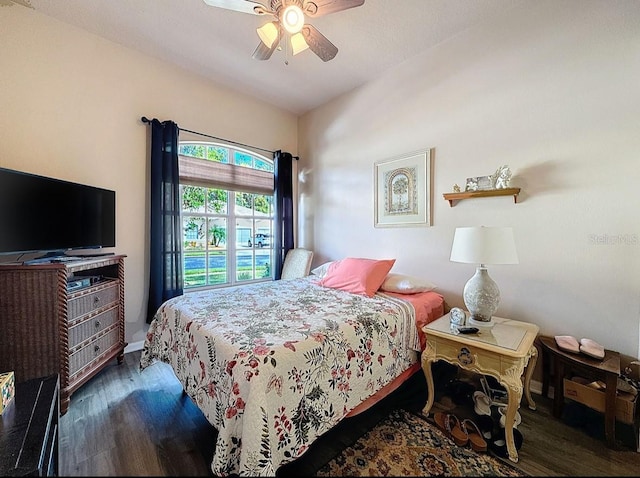 bedroom with a ceiling fan and wood finished floors