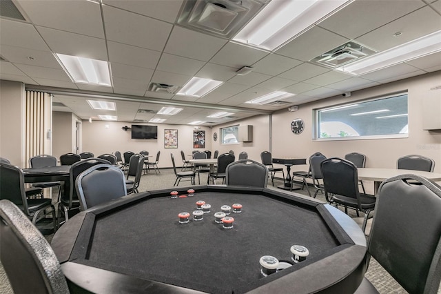 rec room featuring visible vents and a paneled ceiling