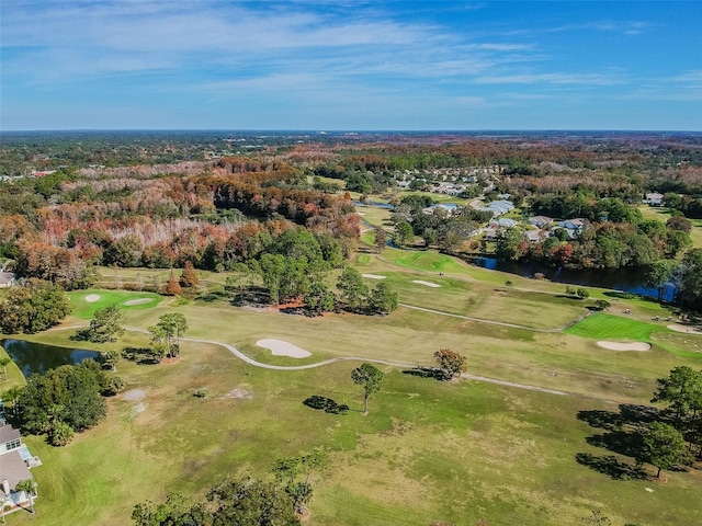 aerial view featuring golf course view and a water view