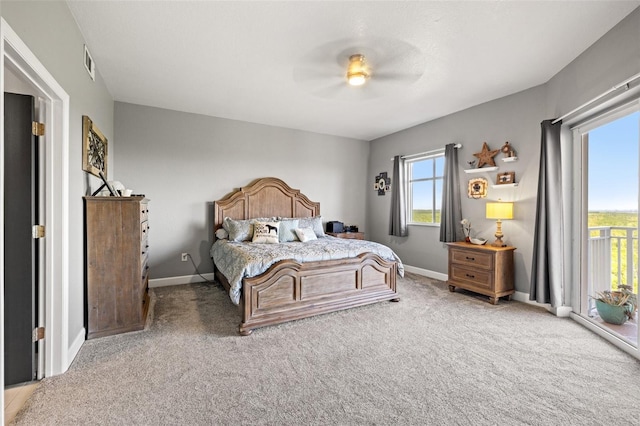 carpeted bedroom featuring a ceiling fan, access to outside, visible vents, and baseboards
