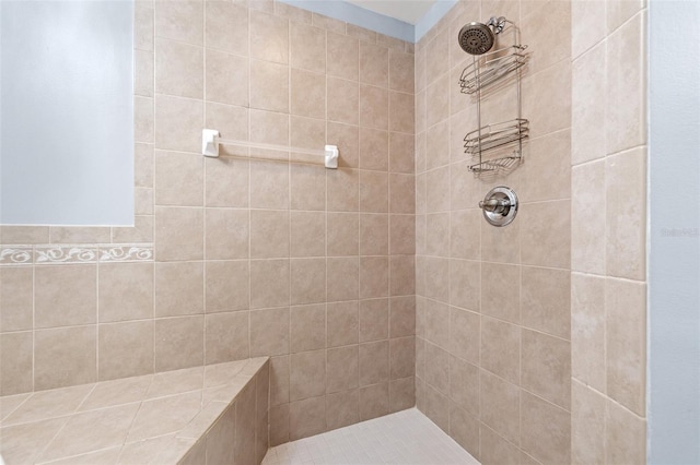 bathroom with tiled shower