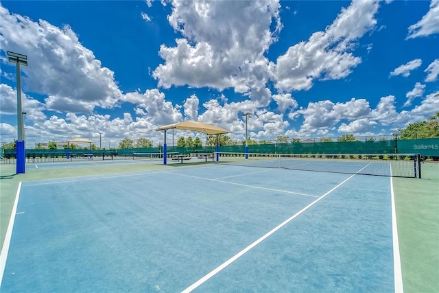 view of sport court featuring fence