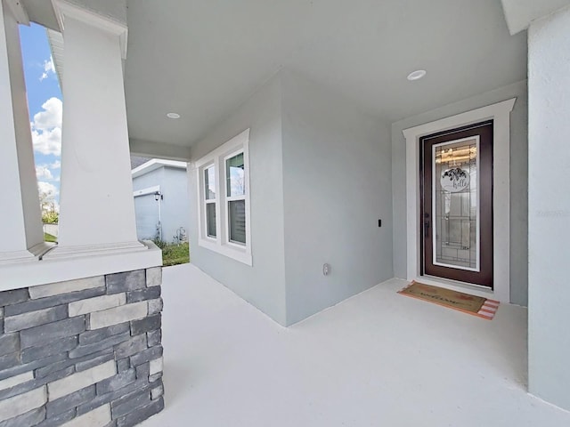 entrance to property with stucco siding