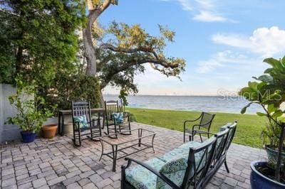 view of patio featuring a water view