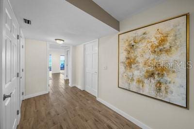 corridor featuring hardwood / wood-style flooring