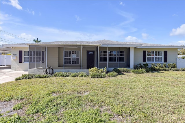 ranch-style home with a front lawn