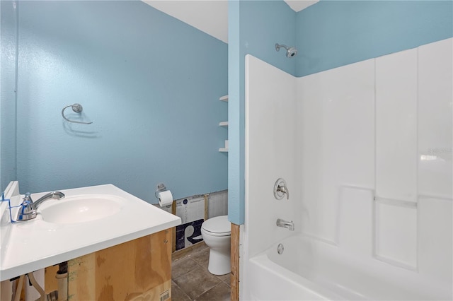 full bathroom with tub / shower combination, vanity, toilet, and tile patterned floors