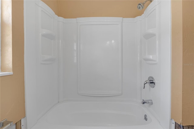 full bath featuring bathtub / shower combination