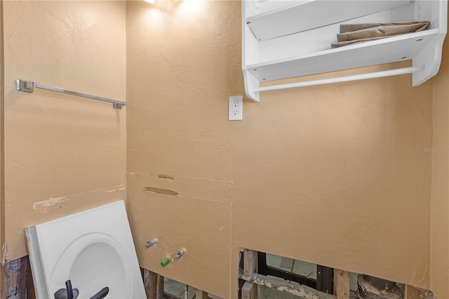 bathroom with a textured wall