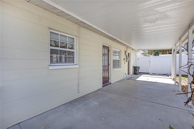 view of patio with a gate and fence