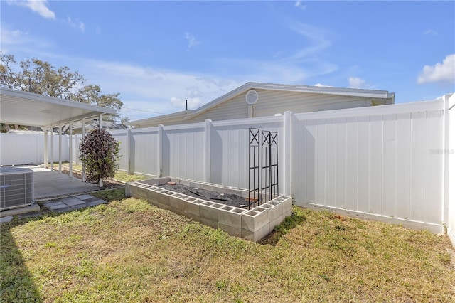 view of outdoor structure with central air condition unit and a fenced backyard