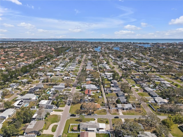 birds eye view of property with a water view and a residential view