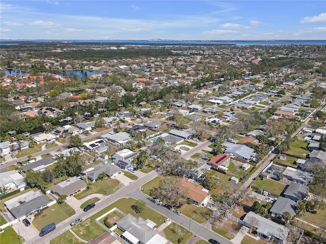 birds eye view of property featuring a water view and a residential view