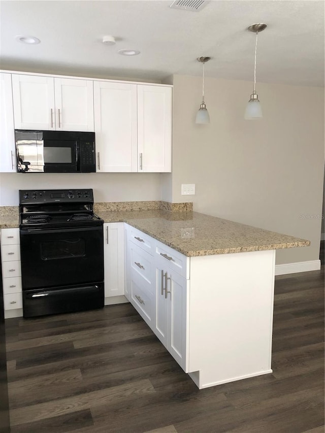 kitchen with light stone counters, hanging light fixtures, white cabinets, a peninsula, and black appliances