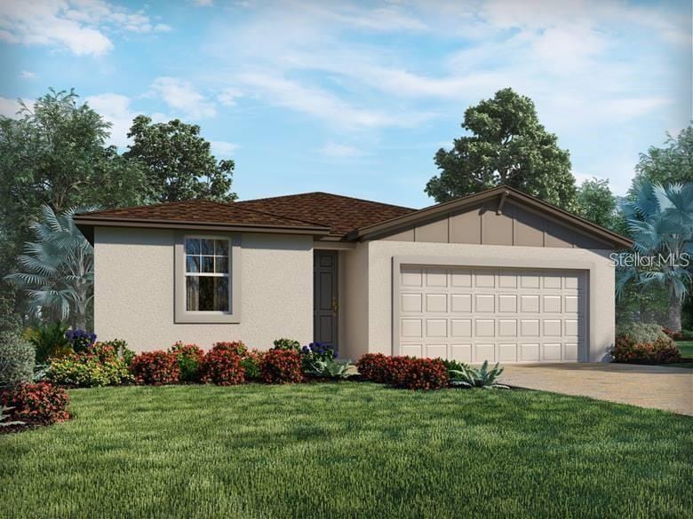 ranch-style house featuring a garage, a front yard, driveway, and stucco siding