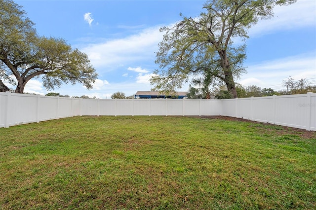 view of yard featuring a fenced backyard