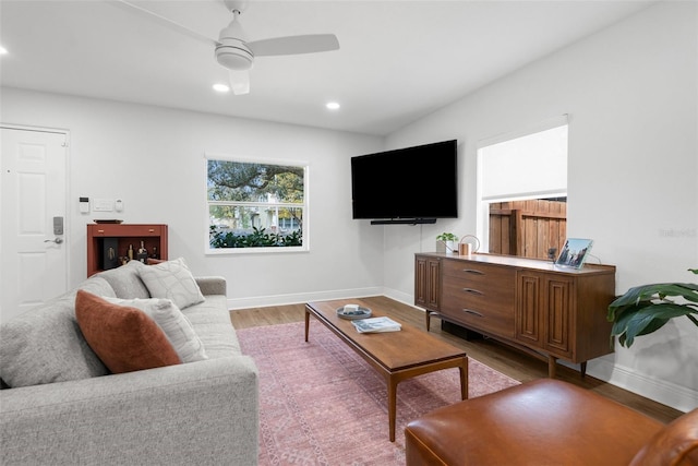 living room featuring recessed lighting, ceiling fan, light wood-style flooring, and baseboards