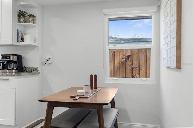 dining space with baseboards