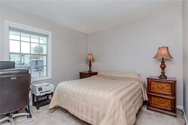 bedroom with light carpet